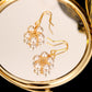 Pearl Wound Plum Blossom Gold-plated Ear Hooks