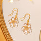 Pearl Wound Plum Blossom Gold-plated Ear Hooks