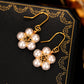 Pearl Wound Plum Blossom Gold-plated Ear Hooks